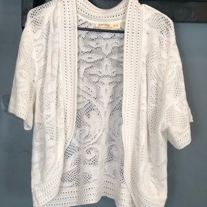 Woman’s white lace cardigan